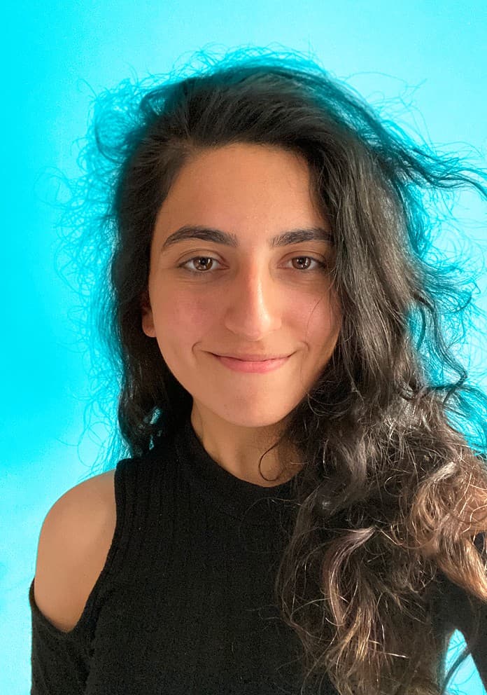 Lilit Balagyozyan smiling and making a peace sign